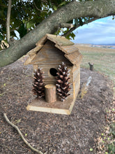 Load image into Gallery viewer, Rustic Wooden Cabin Birdhouse with Pinecone Accents