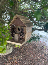Load image into Gallery viewer, Rustic Wooden Cabin Birdhouse with Pinecone Accents